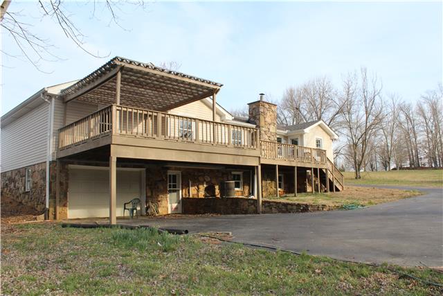 3024 New Hall Road Greenbrier, TN 37073 - Photo 3 of 18 Another view of the rear. Notice the pergola on the deck above the garage below