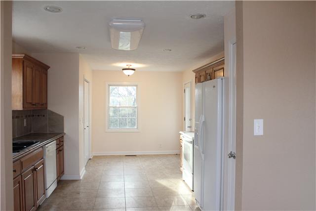 3024 New Hall Road Greenbrier, TN 37073 - Photo 4 of 18 Spacious Kitchen with tile backsplash complete with stove, dishwasher, microwave & refrigerator