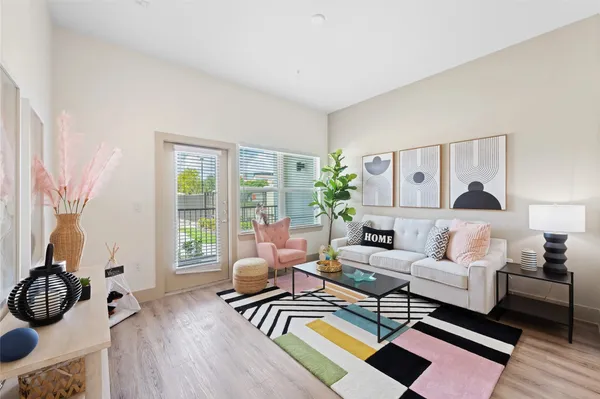 a living room with furniture and a window