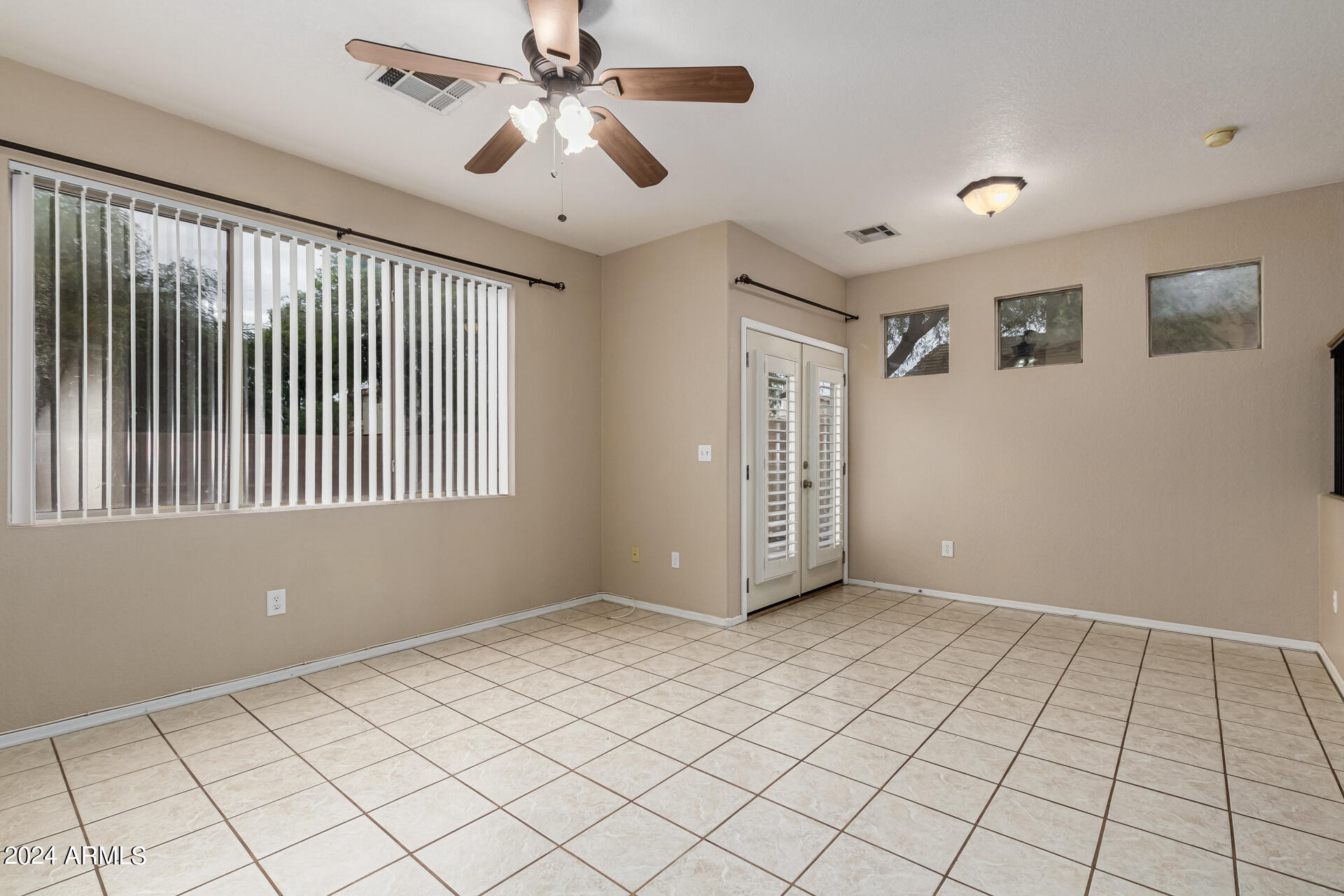 1371 South Boulder Street, Unit A Gilbert, AZ 85296 - Photo 9 of 43 a view of an empty room with window