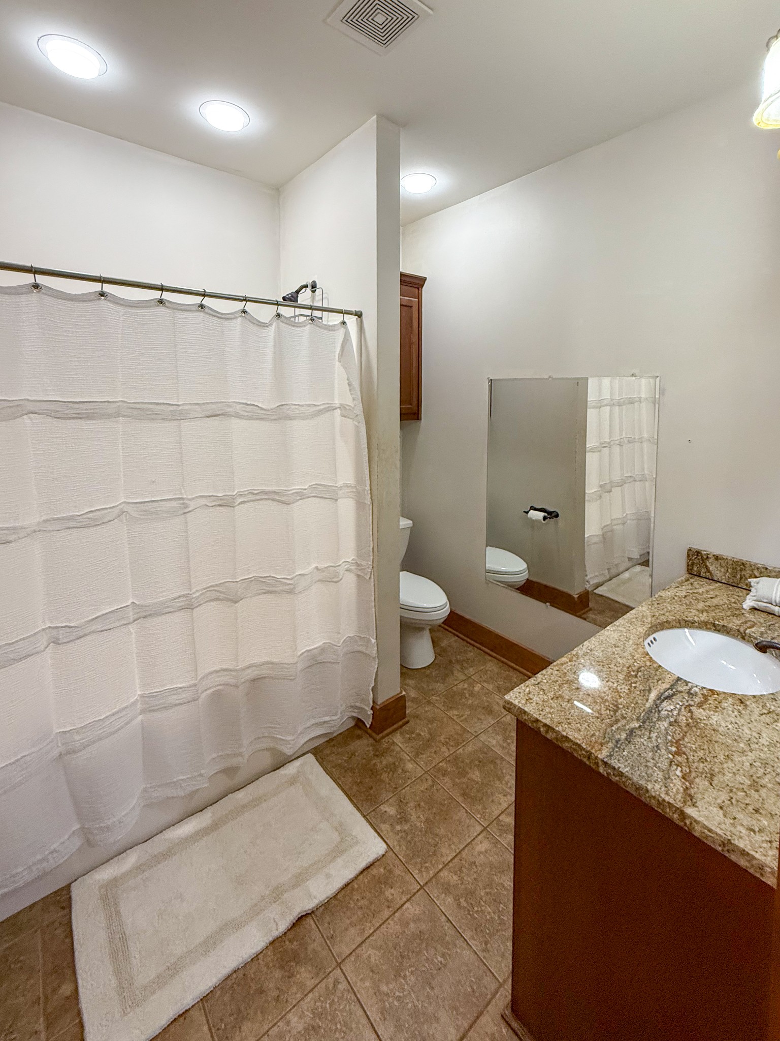 4383 North Chapel Road Franklin, TN 37067 - Photo 13 of 43 a bathroom with a granite countertop sink a toilet and shower
