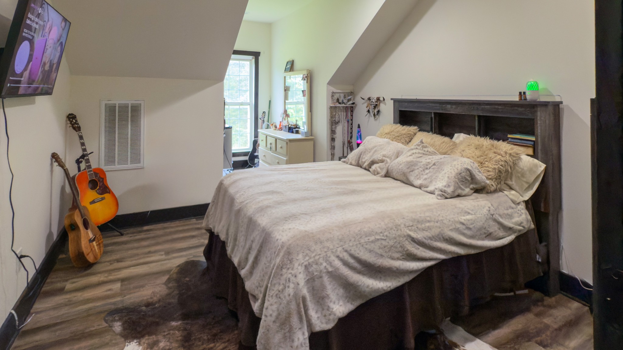 4383 North Chapel Road Franklin, TN 37067 - Photo 16 of 43 a bed sitting in a bedroom next to a window
