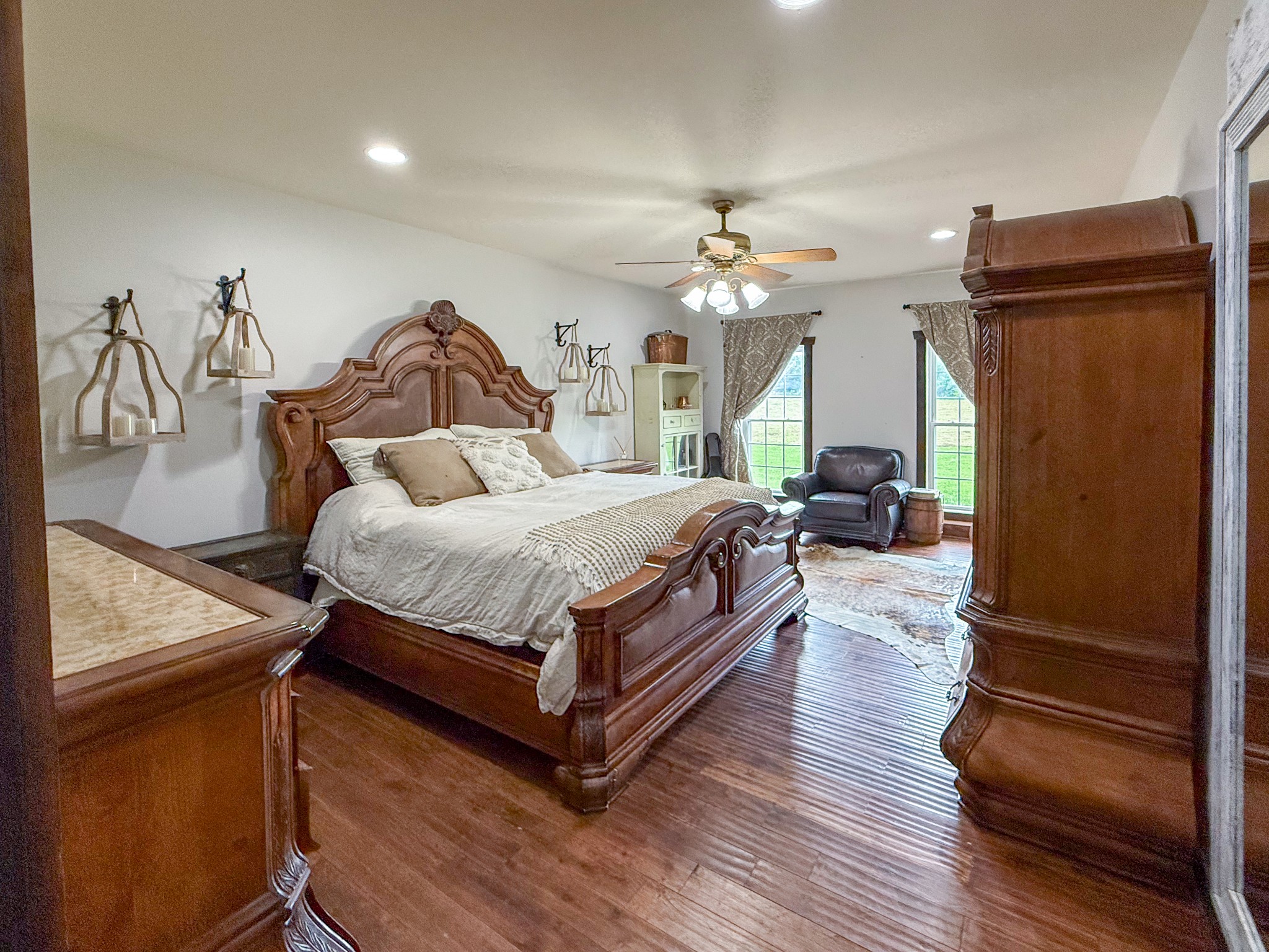 4383 North Chapel Road Franklin, TN 37067 - Photo 7 of 43 a bedroom with a bed dresser and wooden floor