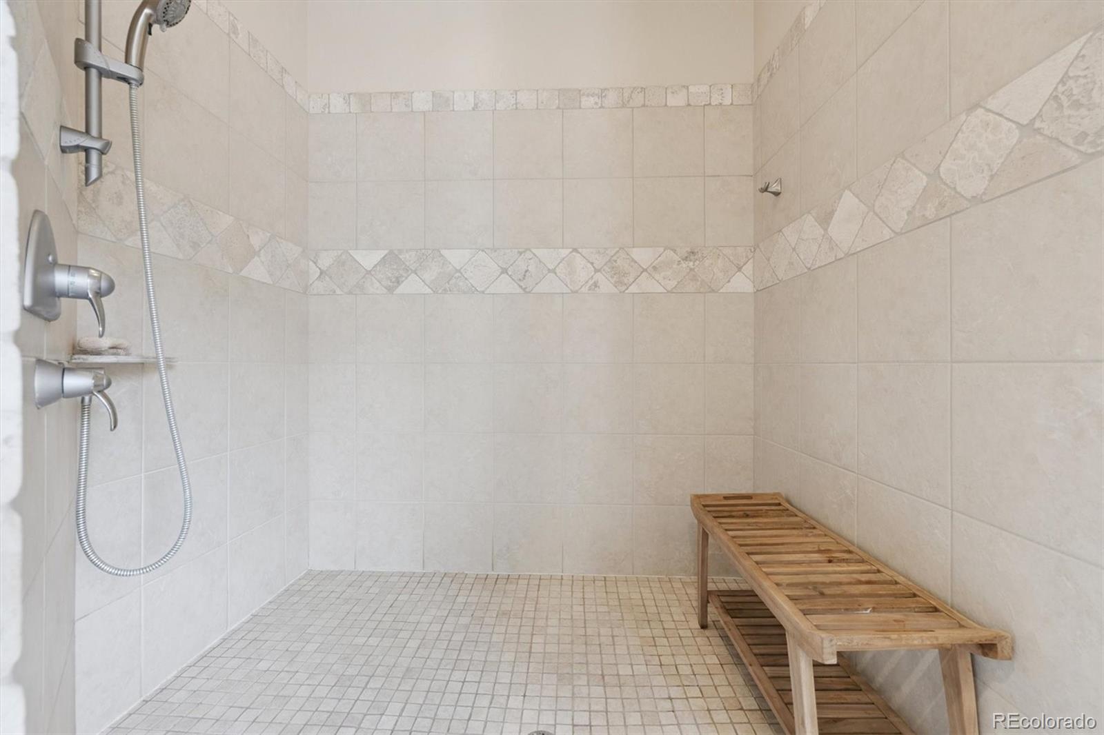 8061 Sugar Loaf Road Larkspur, CO 80118 - Photo 21 of 48 a bathroom with a shower