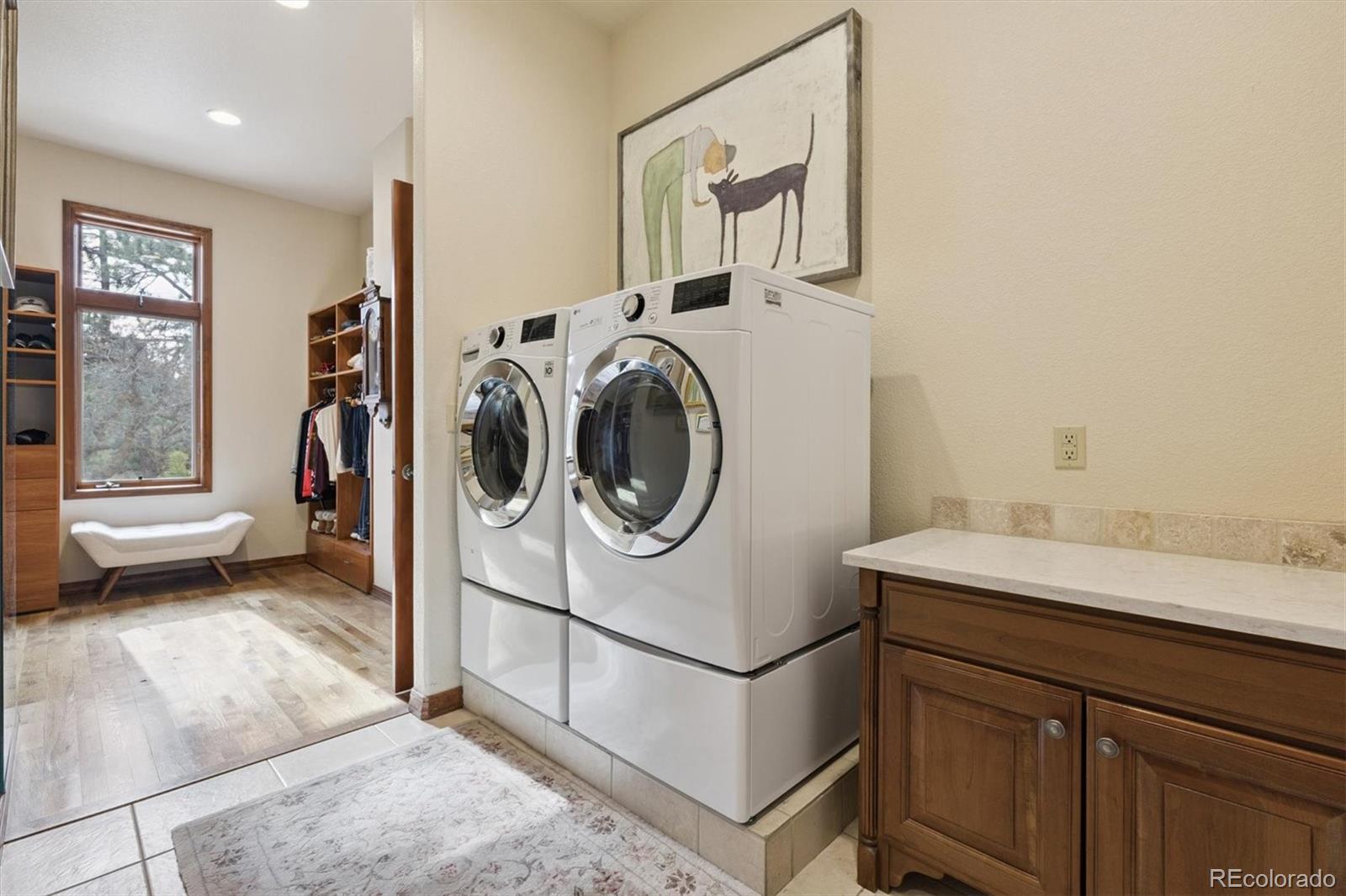 8061 Sugar Loaf Road Larkspur, CO 80118 - Photo 24 of 48 a utility room with dryer and washer