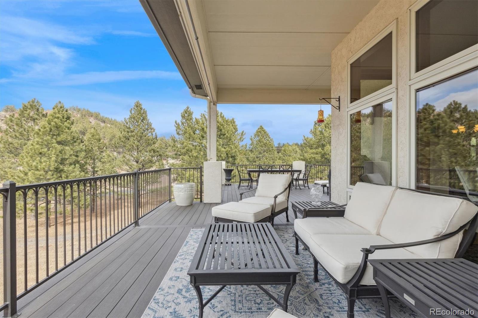 8061 Sugar Loaf Road Larkspur, CO 80118 - Photo 29 of 48 a view of a balcony with couch