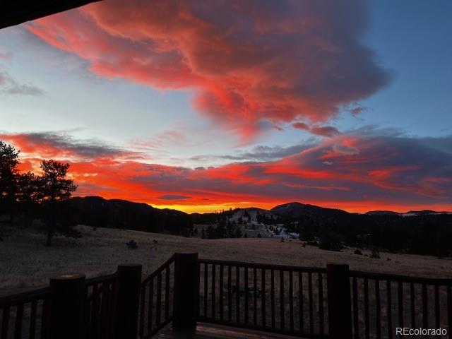 8061 Sugar Loaf Road Larkspur, CO 80118 - Photo 30 of 48 a view of a lake with a mountain