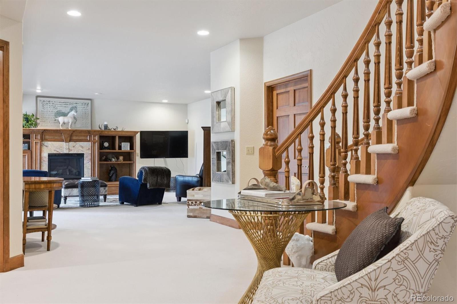 8061 Sugar Loaf Road Larkspur, CO 80118 - Photo 33 of 48 a view of a livingroom with furniture and a flat screen tv