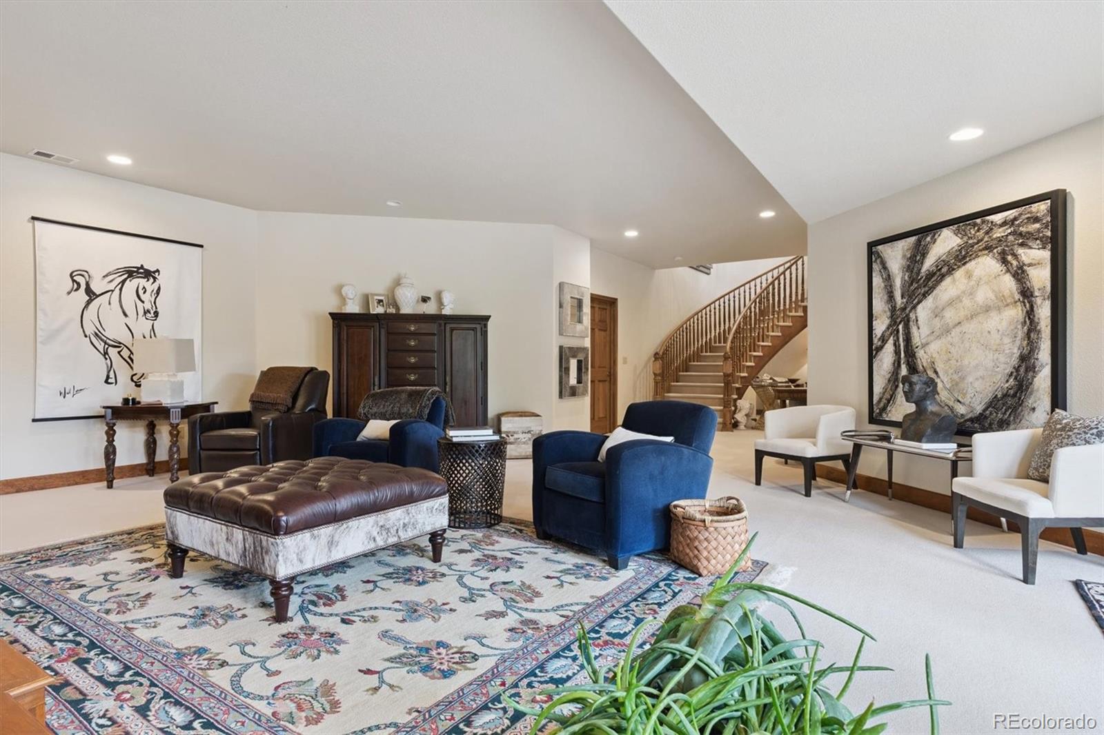 8061 Sugar Loaf Road Larkspur, CO 80118 - Photo 36 of 48 a living room with furniture a rug and a fireplace