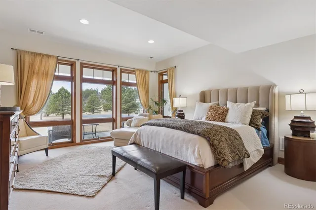 a bed room with a bed and a couch