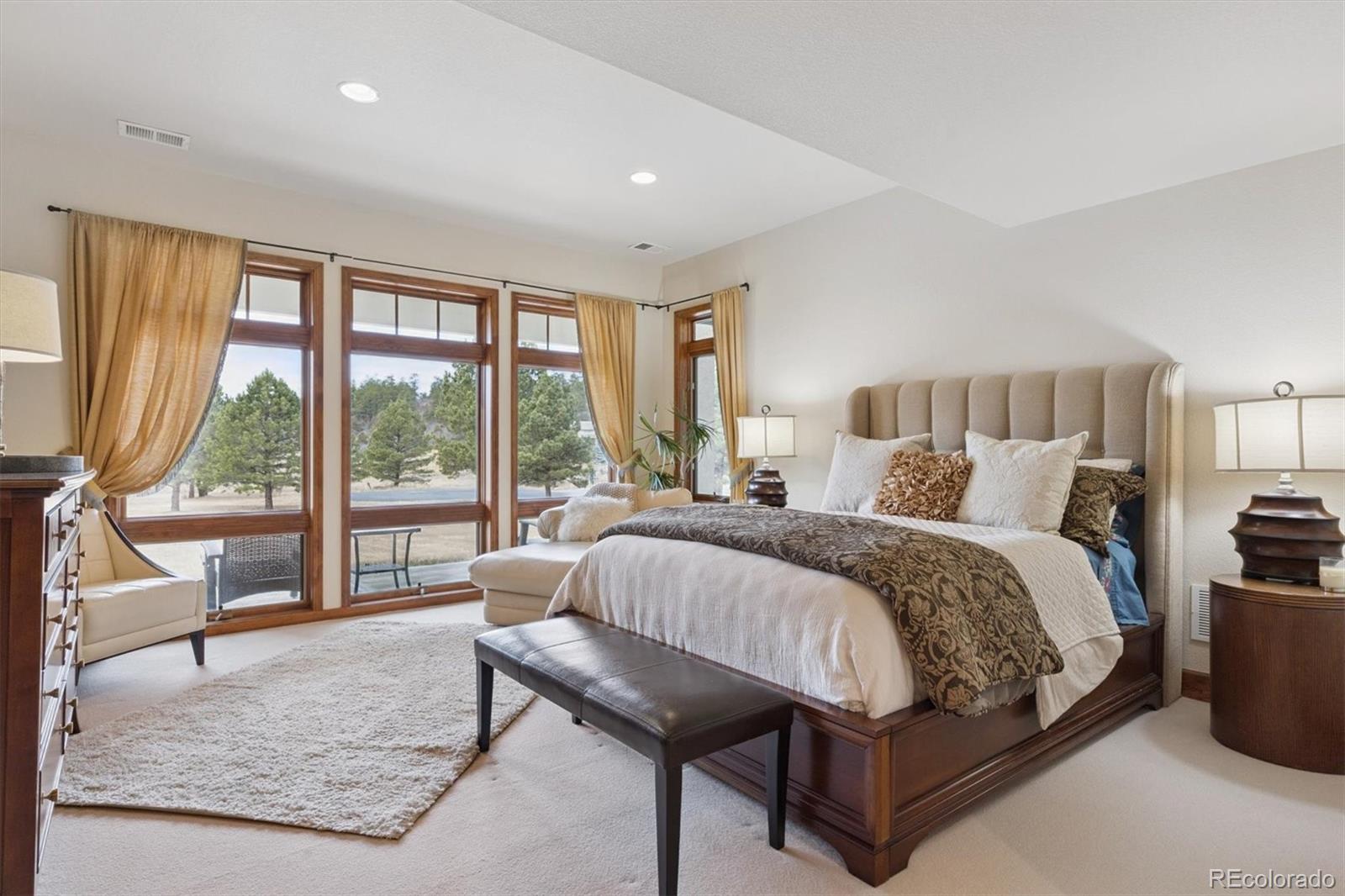 8061 Sugar Loaf Road Larkspur, CO 80118 - Photo 39 of 48 a bed room with a bed and a couch