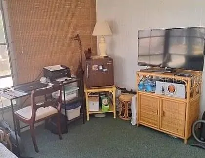 a kitchen with furniture and a stove top oven