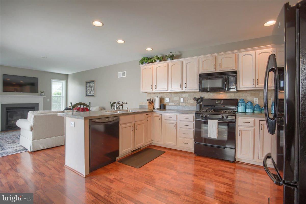 716 Wallingford Road Lititz, PA 17543 - Photo 14 of 38 Open Kitchen with Laminate Floors