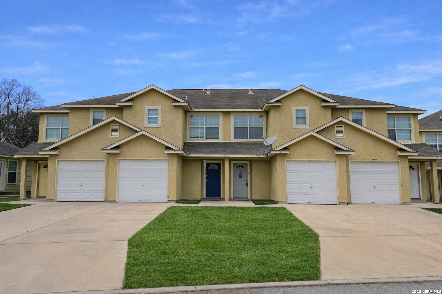 front view of a house with a yard