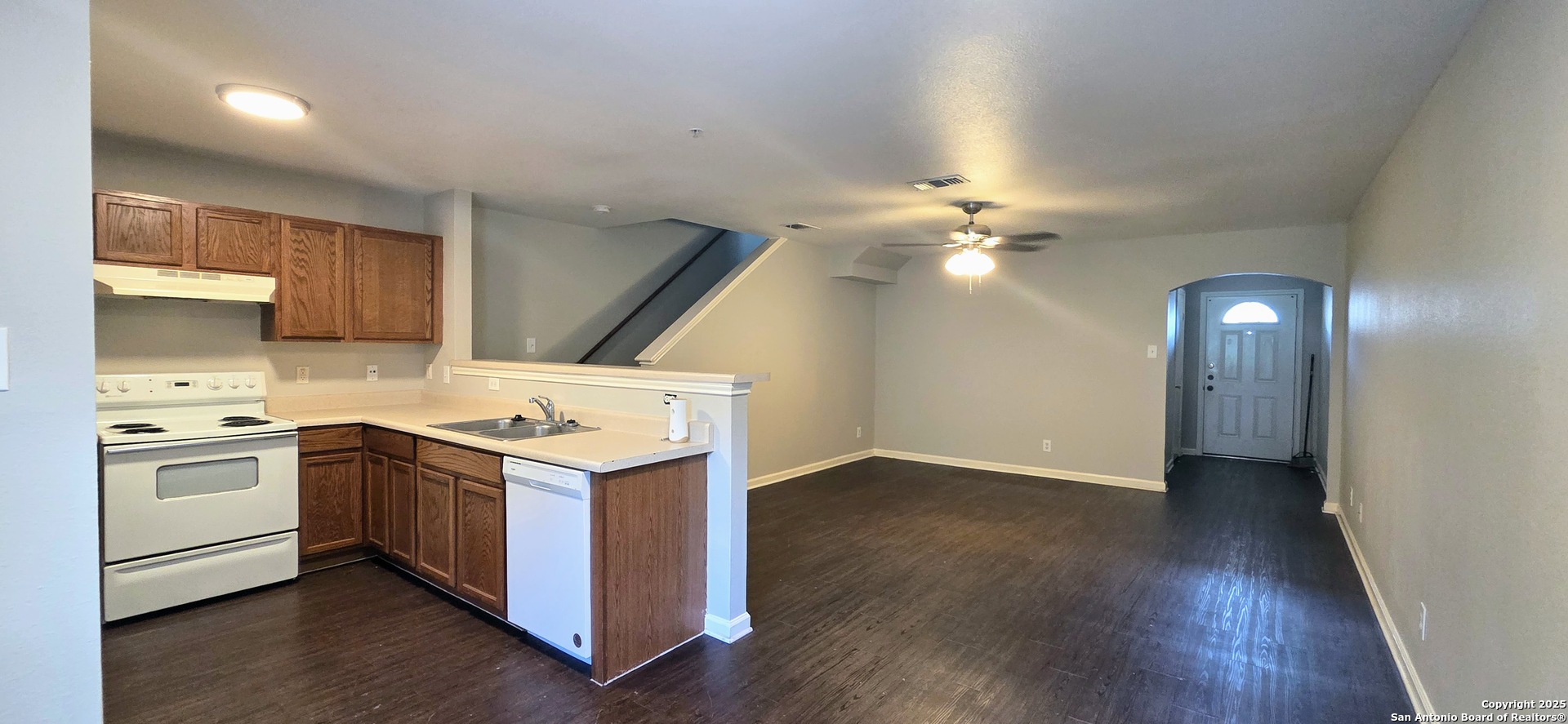 10007 Vasso View, Unit 3 Converse, TX 78109 - Photo 3 of 4 a kitchen with a stove and a sink