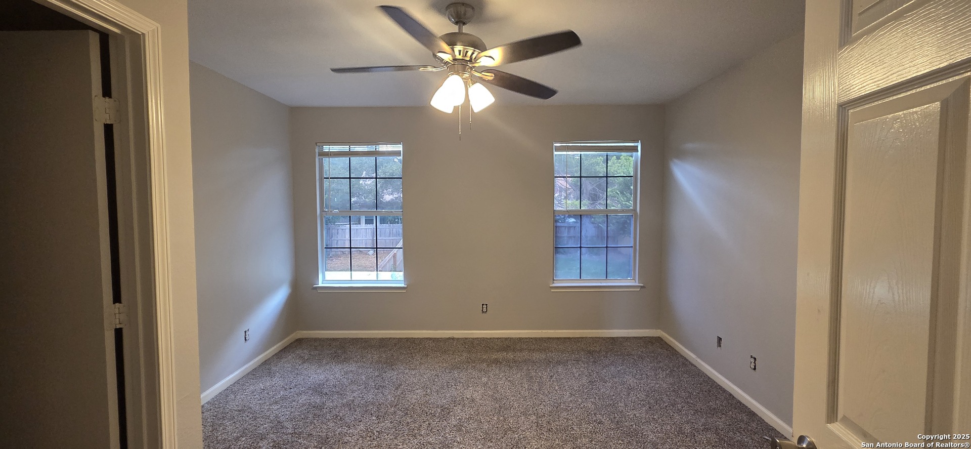 10007 Vasso View, Unit 3 Converse, TX 78109 - Photo 4 of 4 a view of an empty room with a window