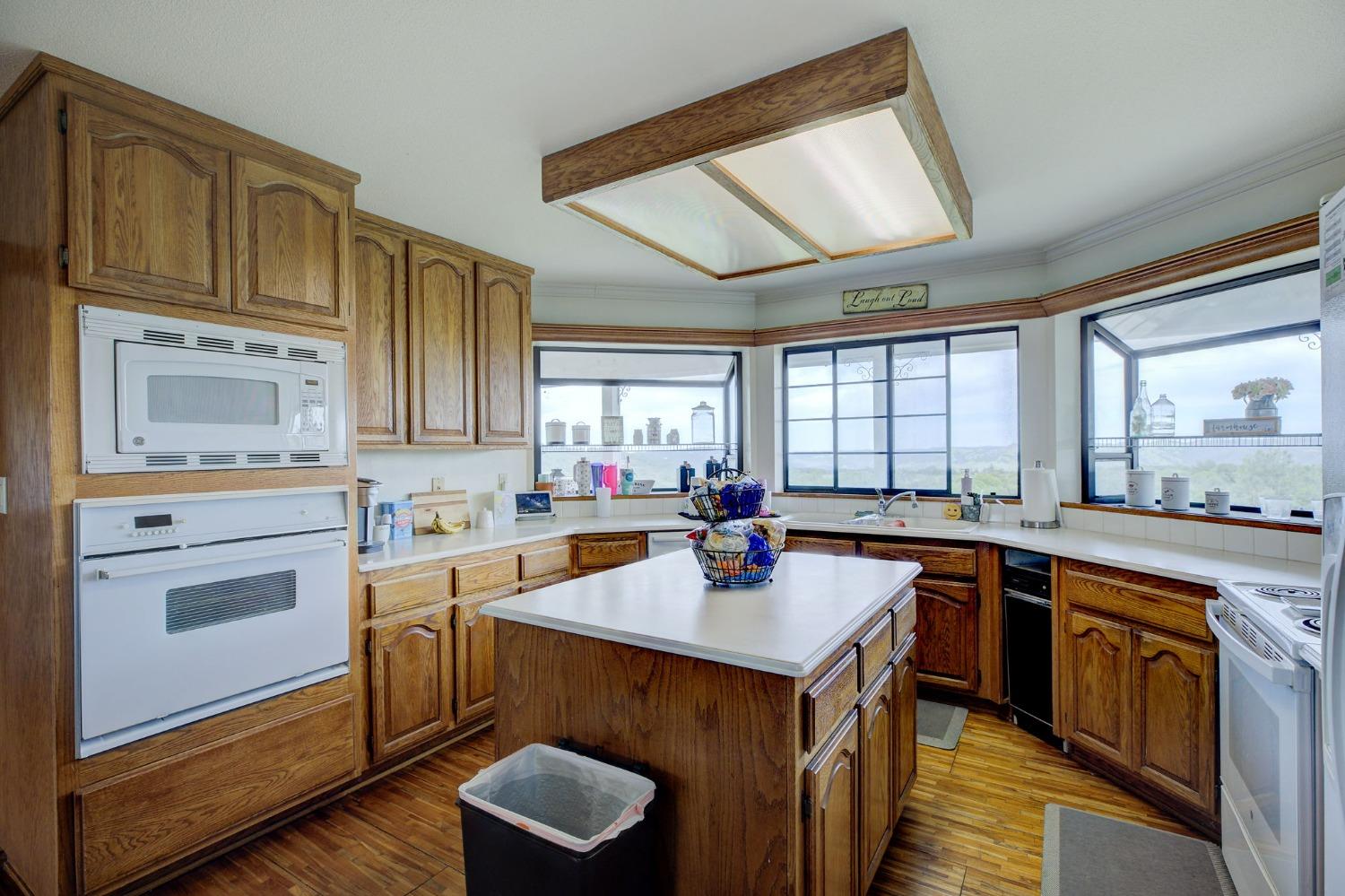1095 Cold Springs Road Placerville, CA 95667 - Photo 15 of 55 a kitchen with a sink stove and cabinets