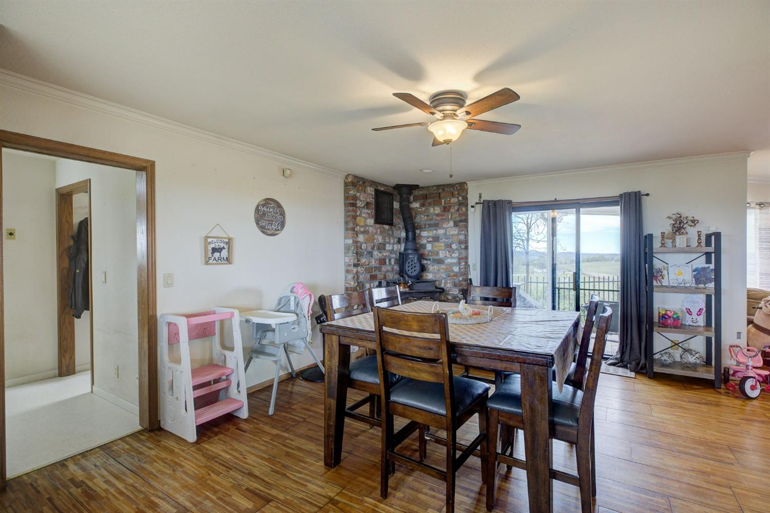 1095 Cold Springs Road Placerville, CA 95667 - Photo 17 of 55 a view of a dining room with furniture window and wooden floor
