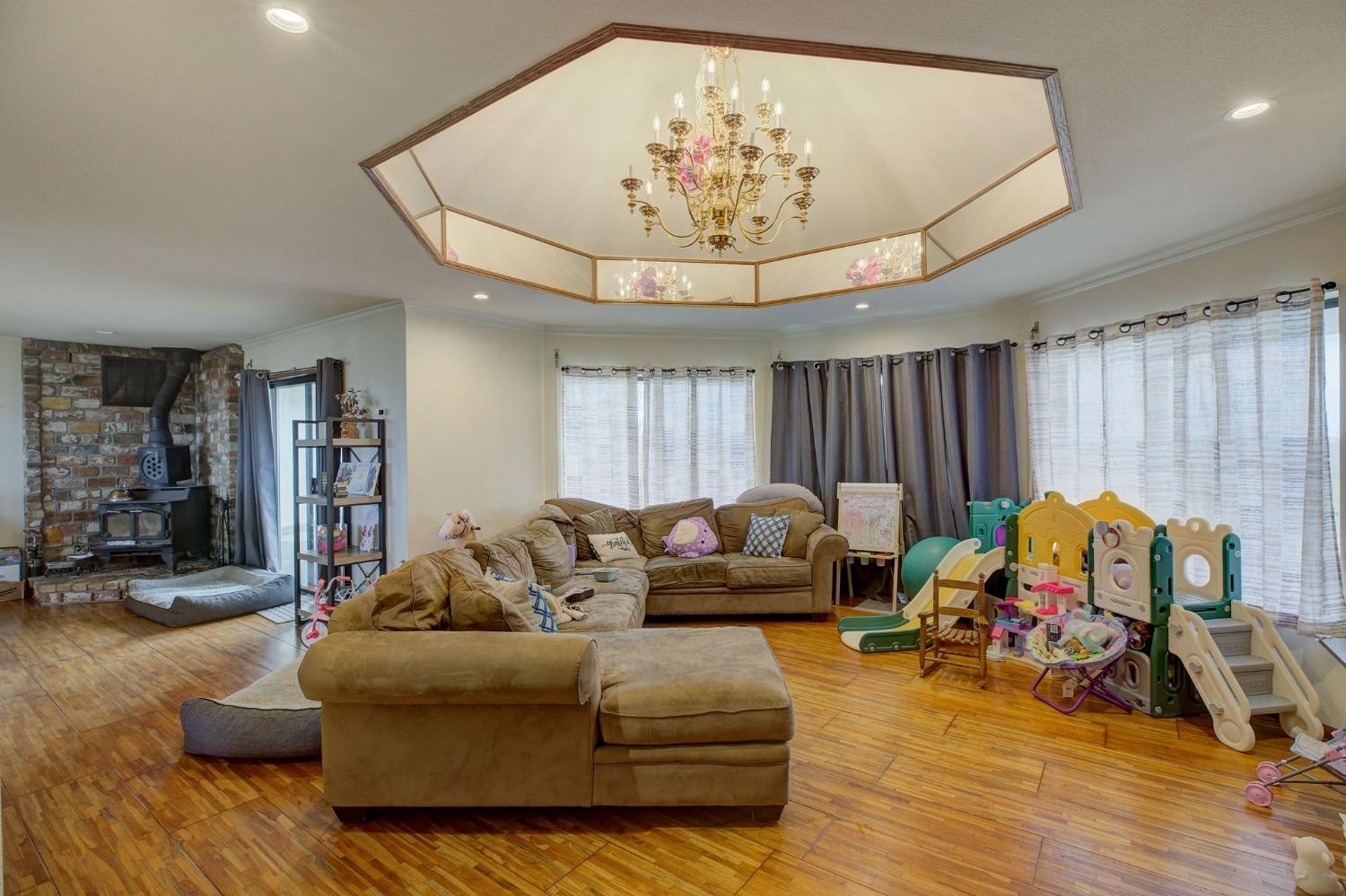 1095 Cold Springs Road Placerville, CA 95667 - Photo 20 of 55 a living room with furniture and a chandelier