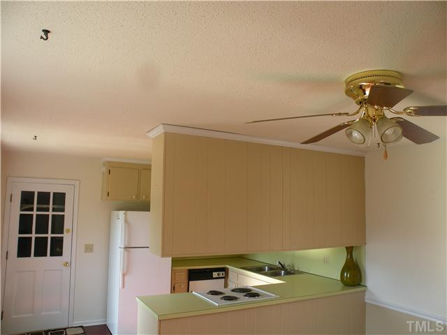 2109 James Slaughter Road Fuquay-Varina, NC 27526 - Photo 7 of 14 Another view of the kitchen with its freshly painted walls and trim!!! Kitchen
