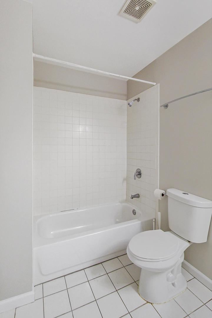 2101 West Rice Street, Unit 103 Chicago, IL 60622 - Photo 20 of 44 a bathroom with a toilet and a bath tub