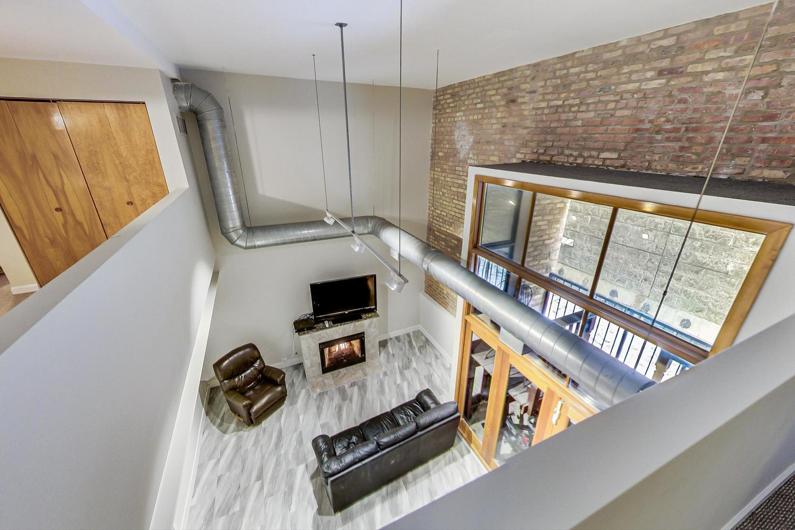 2101 West Rice Street, Unit 103 Chicago, IL 60622 - Photo 23 of 44 a view of an entryway with wooden floor