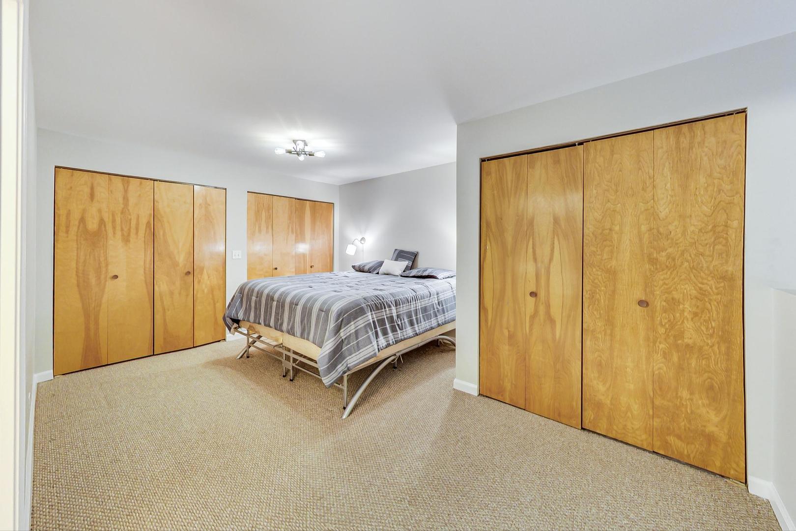 2101 West Rice Street, Unit 103 Chicago, IL 60622 - Photo 25 of 44 a bedroom with a bed and a window