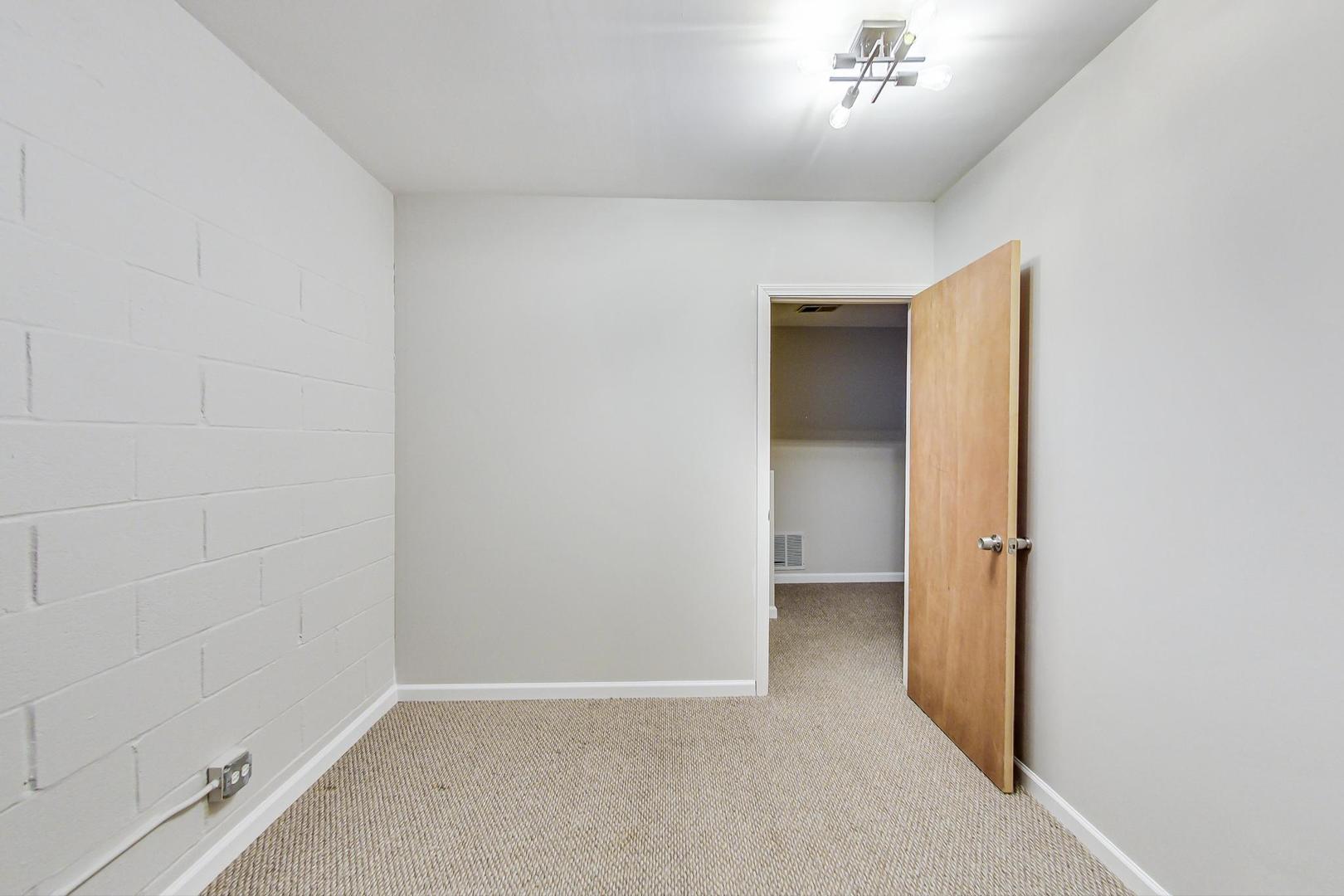 2101 West Rice Street, Unit 103 Chicago, IL 60622 - Photo 32 of 44 an empty room with a bathroom