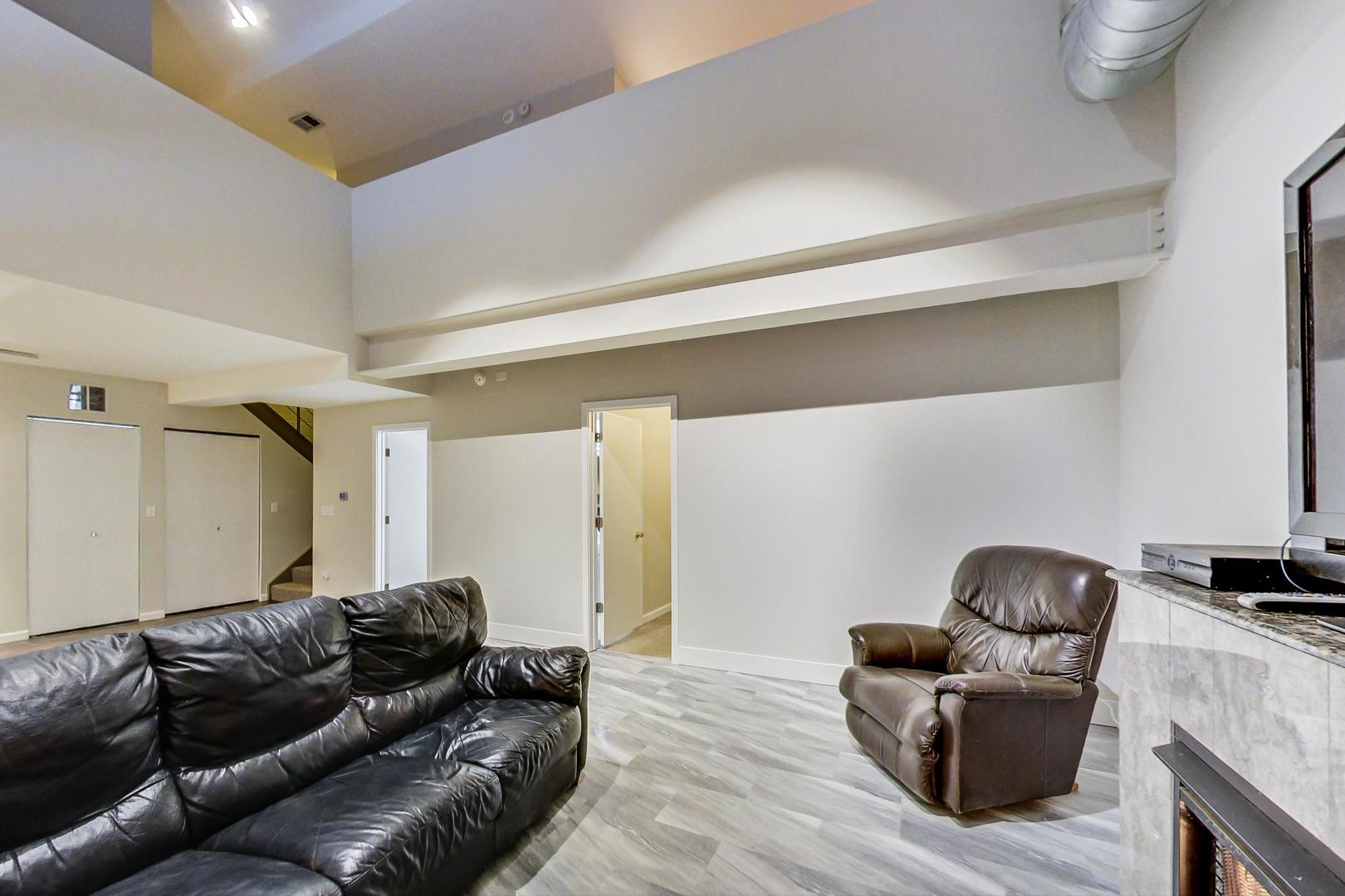 2101 West Rice Street, Unit 103 Chicago, IL 60622 - Photo 10 of 44 a living room with furniture and a couch