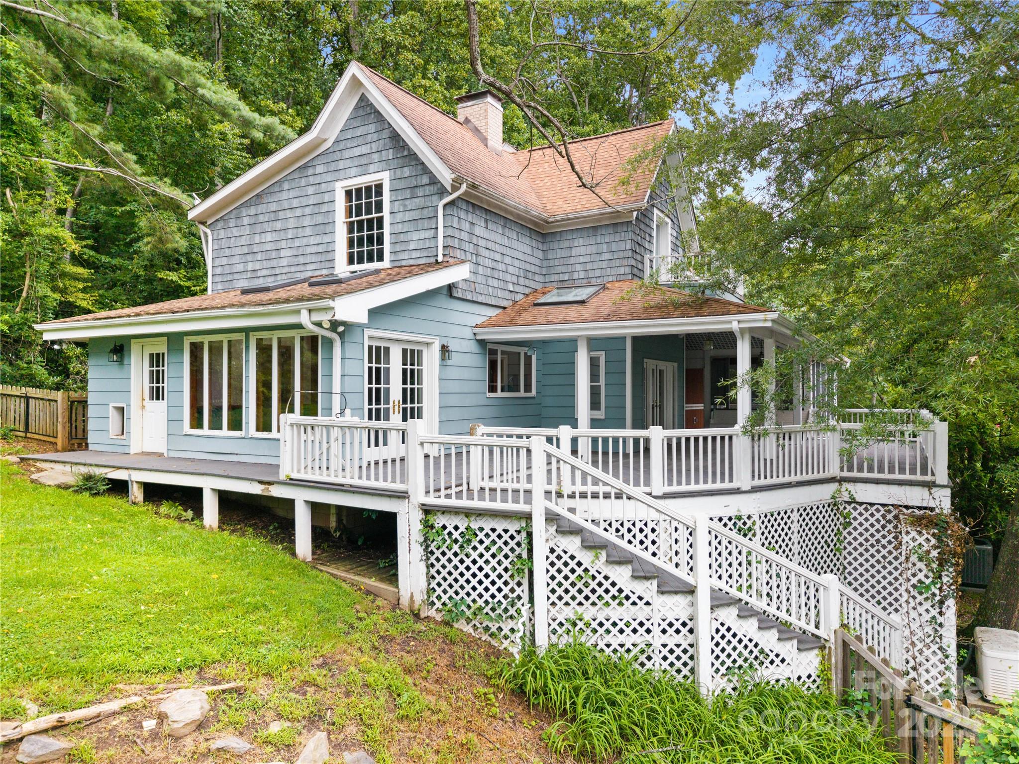 32 Delano Road Asheville, NC 28805 - Photo 1 of 46 a front view of a house with a yard