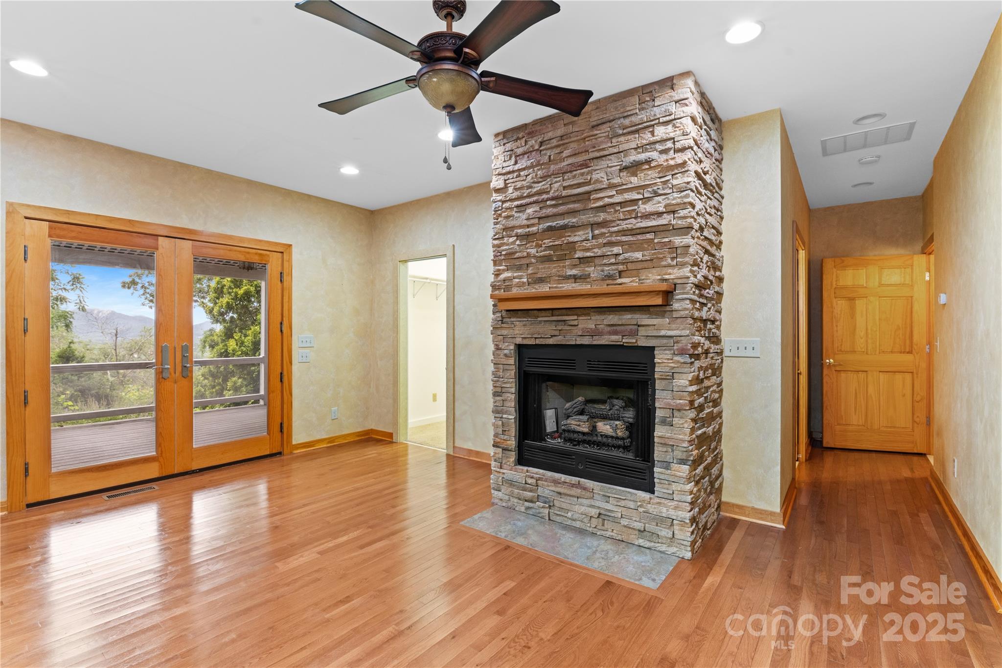 32 Delano Road Asheville, NC 28805 - Photo 20 of 46 a view of an empty room with glass door and wooden floor