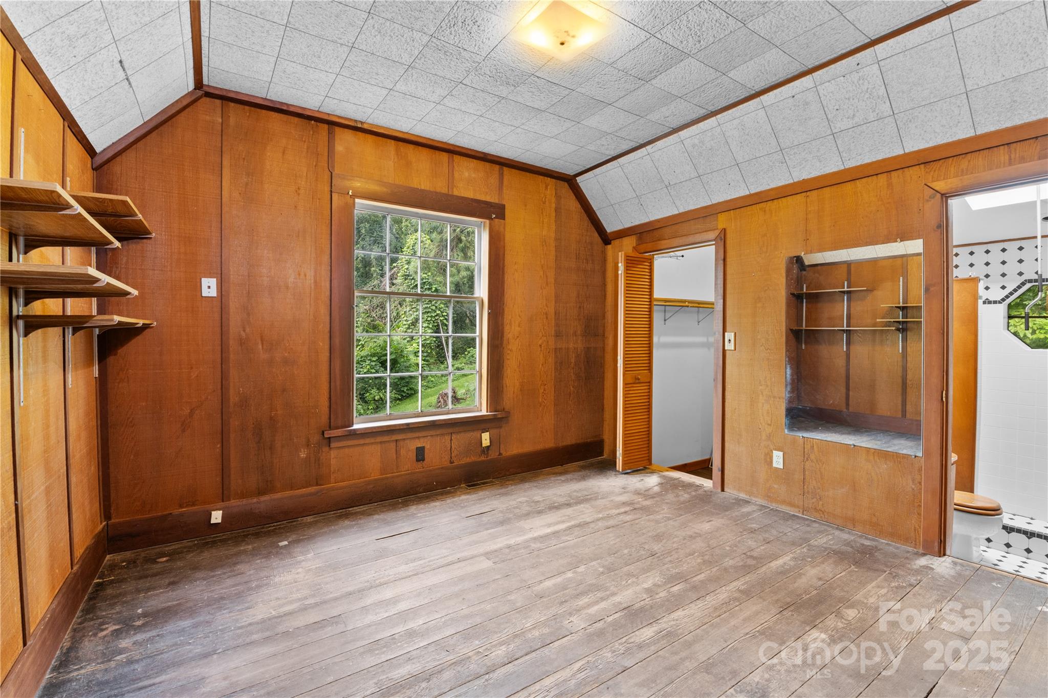 32 Delano Road Asheville, NC 28805 - Photo 23 of 46 a view of an empty room with a window and bathroom