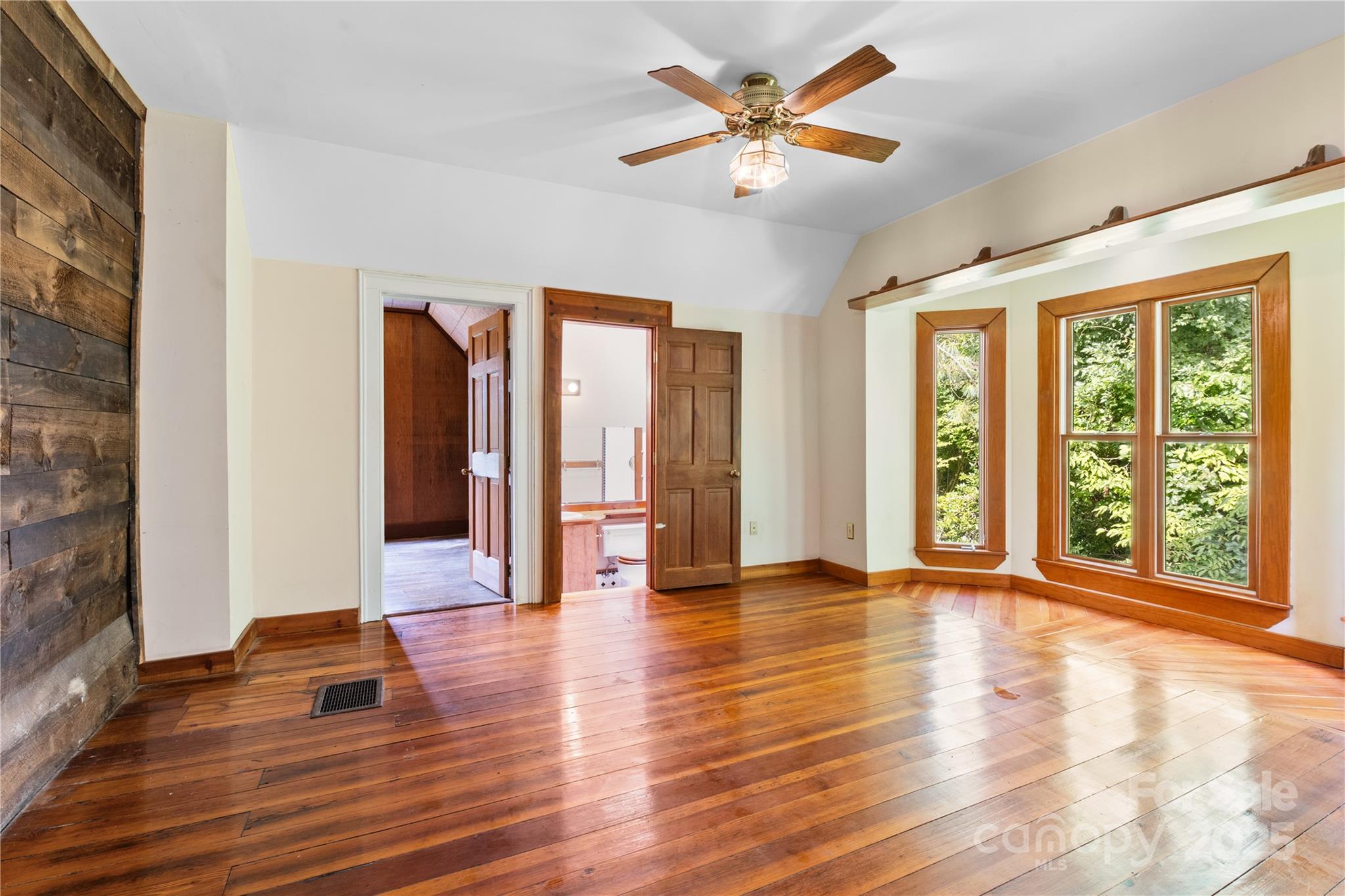 32 Delano Road Asheville, NC 28805 - Photo 27 of 46 a view of an empty room with window and wooden floor