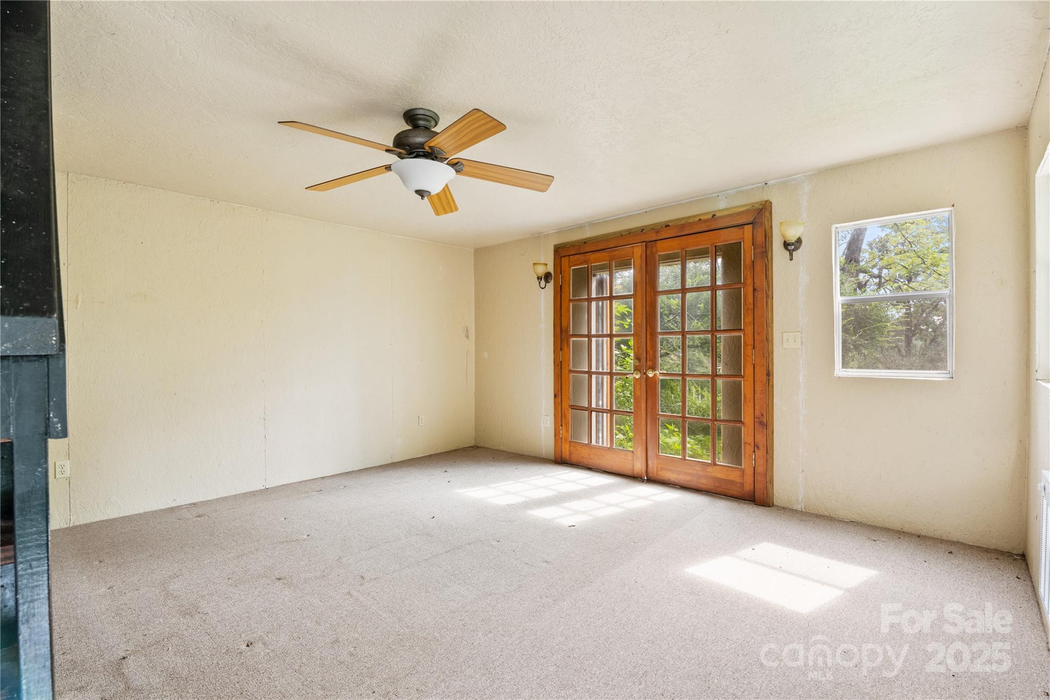 32 Delano Road Asheville, NC 28805 - Photo 40 of 46 a view of a livingroom with a ceiling fan and window