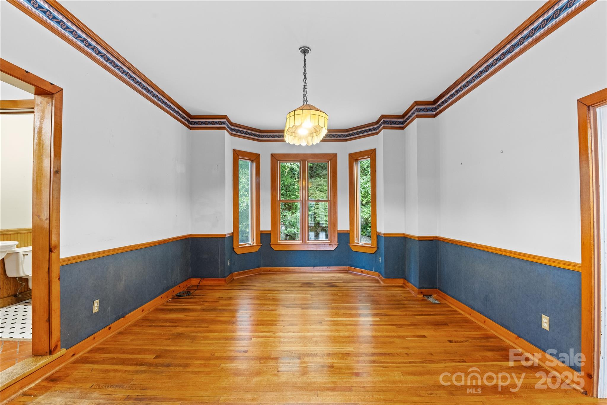 32 Delano Road Asheville, NC 28805 - Photo 4 of 46 a large bed in a room next to a window