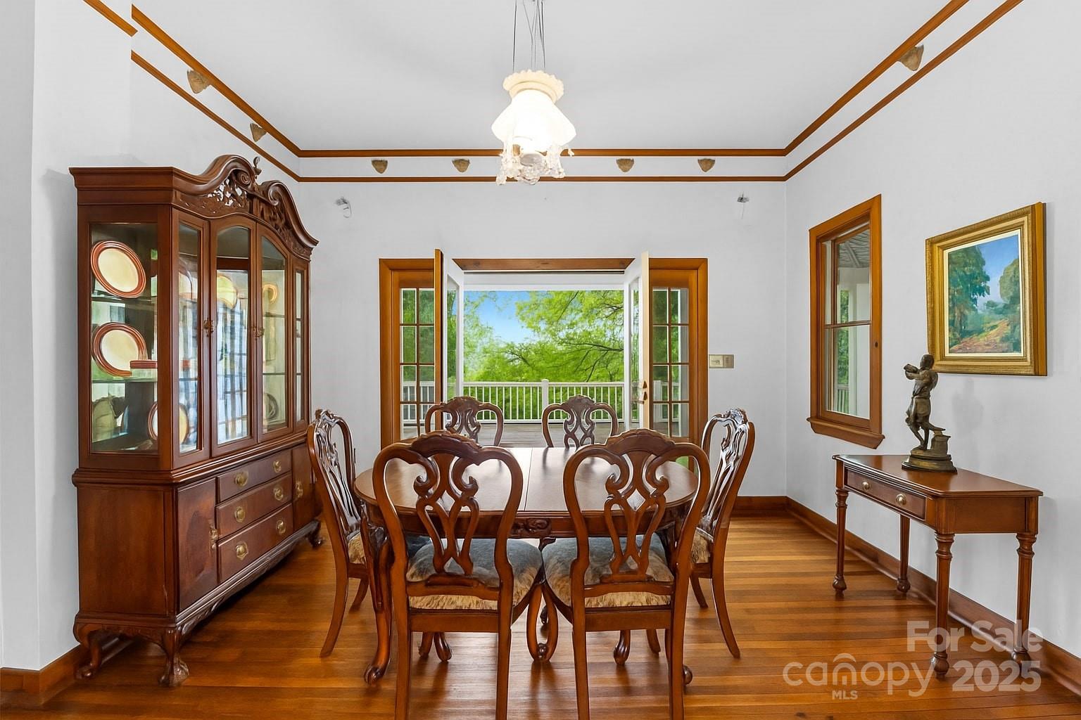 32 Delano Road Asheville, NC 28805 - Photo 6 of 46 a view of a dining room with furniture window and wooden floor
