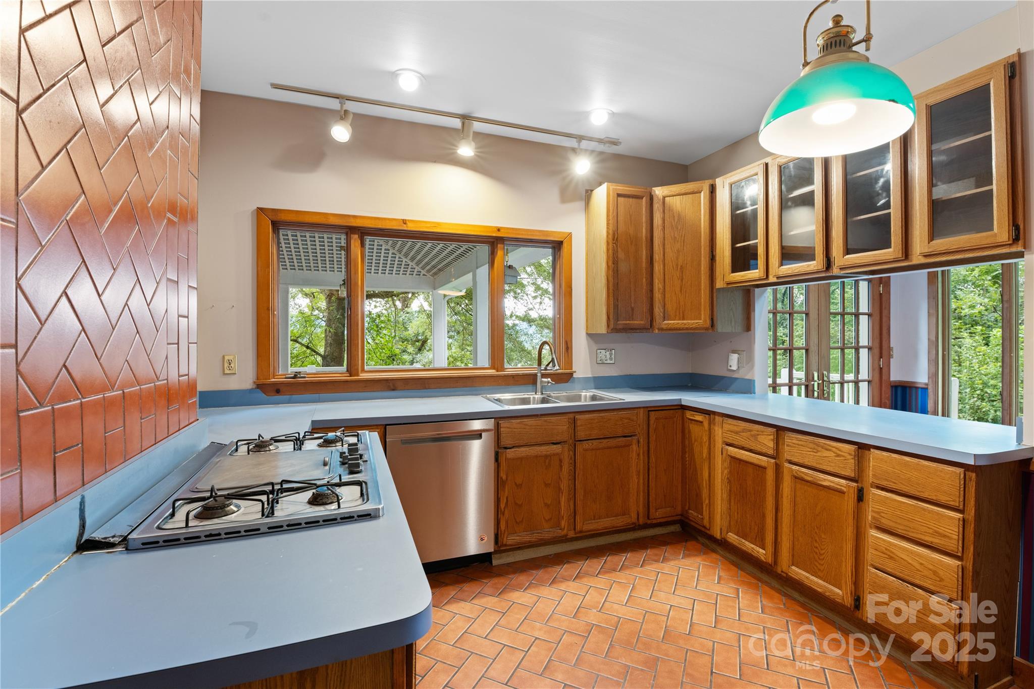32 Delano Road Asheville, NC 28805 - Photo 9 of 46 a kitchen with stainless steel appliances granite countertop a stove a sink and a microwave