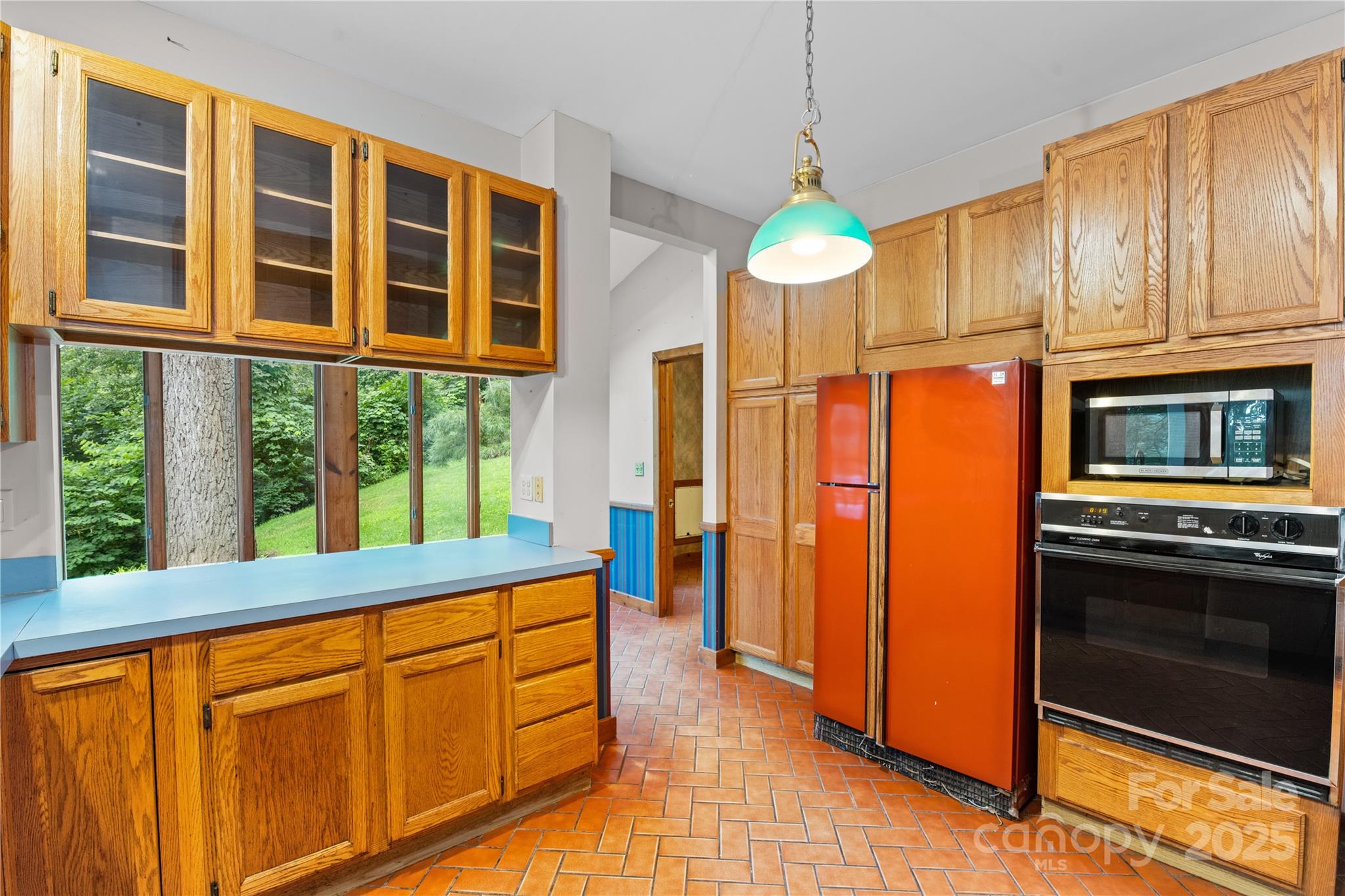 32 Delano Road Asheville, NC 28805 - Photo 10 of 46 a kitchen that has a lot of cabinets and stainless steel appliances