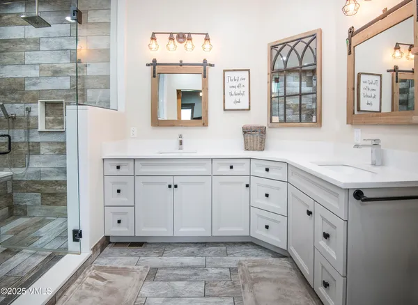 a room with wooden floor pool table and windows