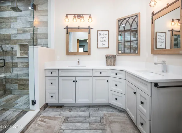a room with wooden floor pool table and windows