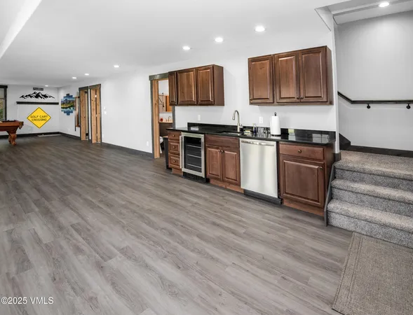 a view of a livingroom with furniture and an empty room