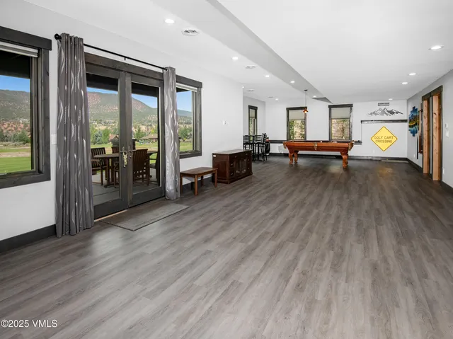 a bedroom with a bed a table and a dresser