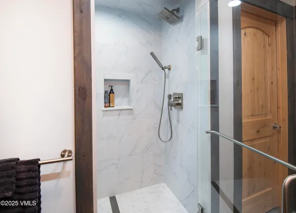 a view of a lush green hillside and houses