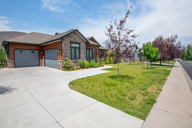 an aerial view of a house with a big yard