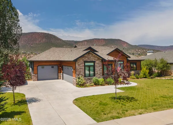 an aerial view of a house with a ocean view