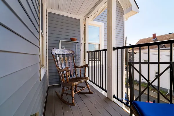 a view of a balcony with furniture