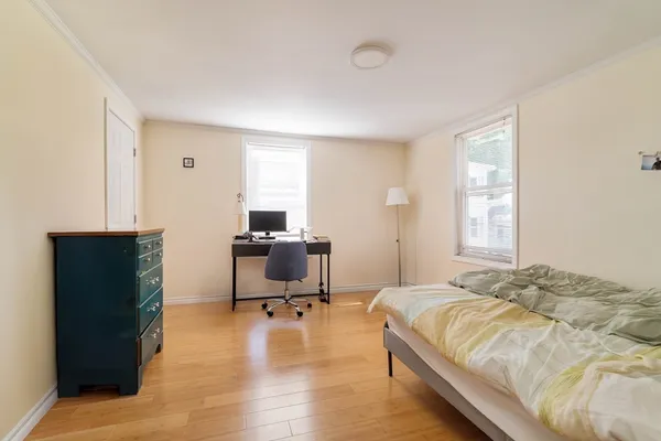 a bedroom with a bed and a table in it