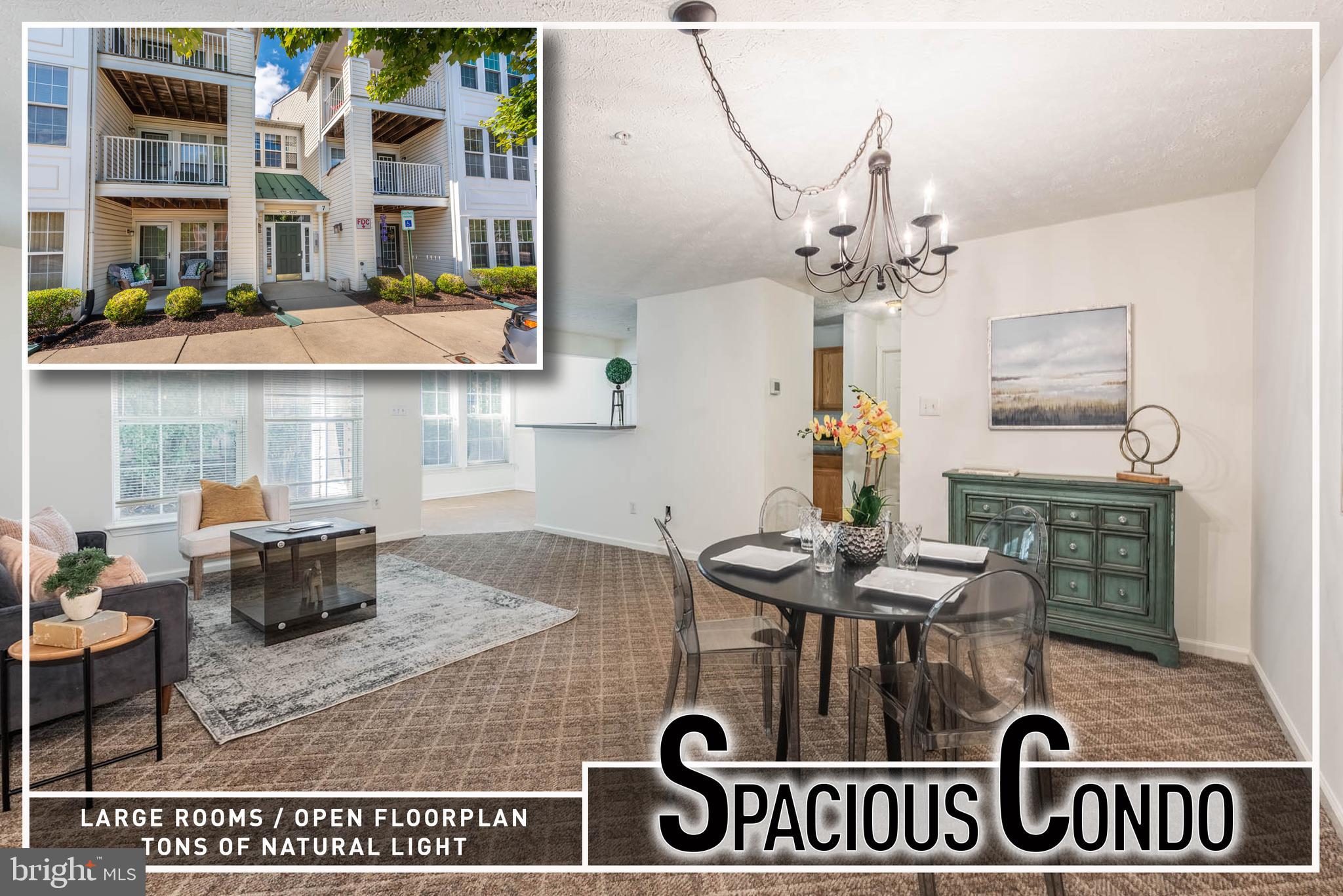 a front view of a kitchen with granite countertop lots of counter top space and dining table