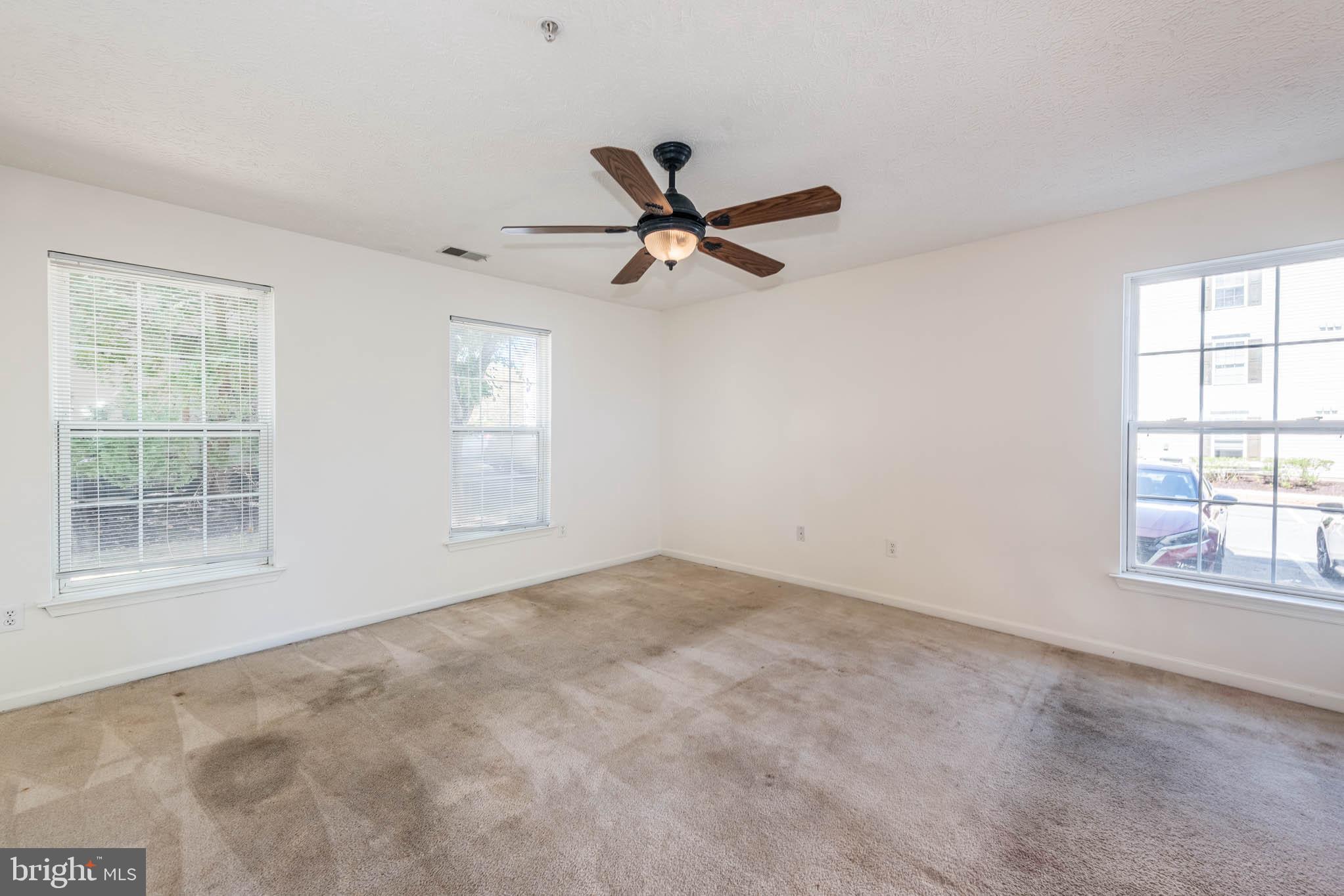 9715 Reese Farm Road, Unit 9715 Owings Mills, MD 21117 - Photo 17 of 25 an empty room with windows and fan