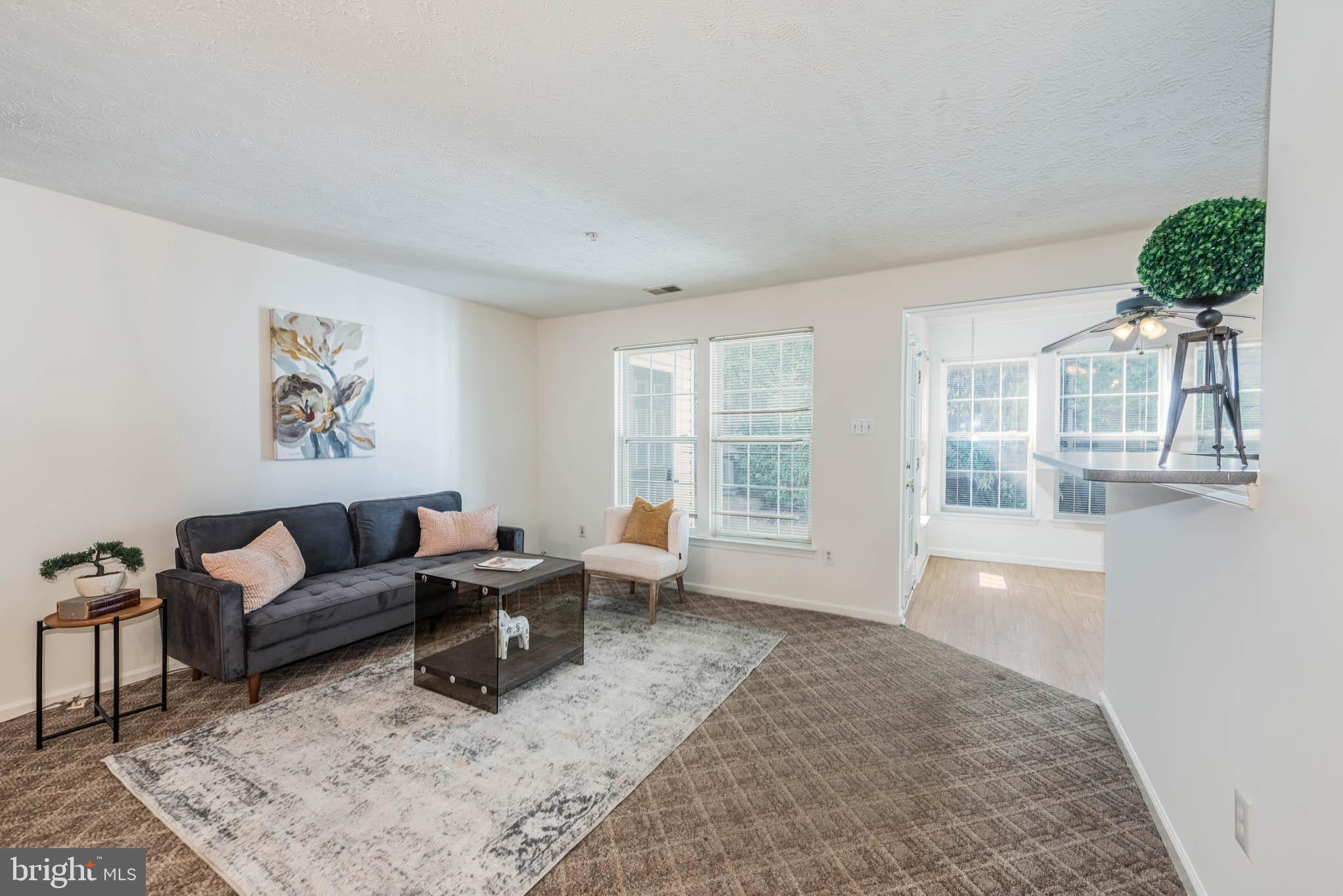 9715 Reese Farm Road, Unit 9715 Owings Mills, MD 21117 - Photo 2 of 25 a living room with furniture and a large window